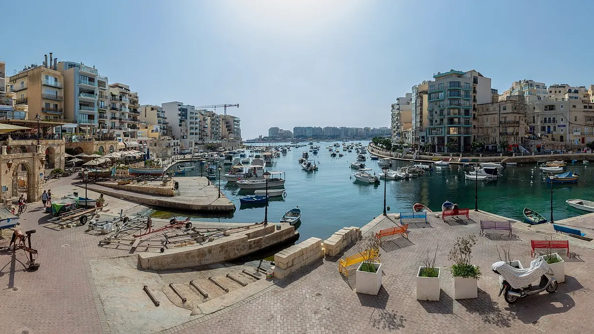 Spinola Bay in St Julian's, Malta, with boats and waterfront buildings