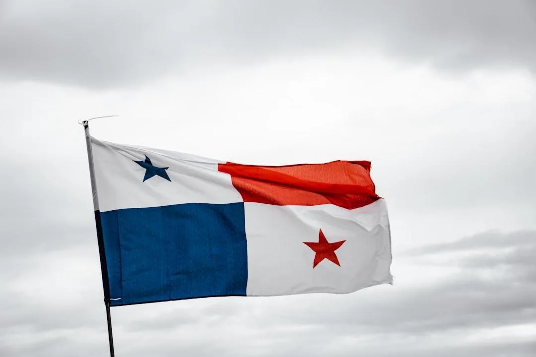 The flag of Panama flying against an overcast sky