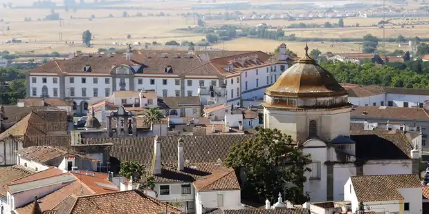 Whitewashed houses and terracotta rooftops in Évora