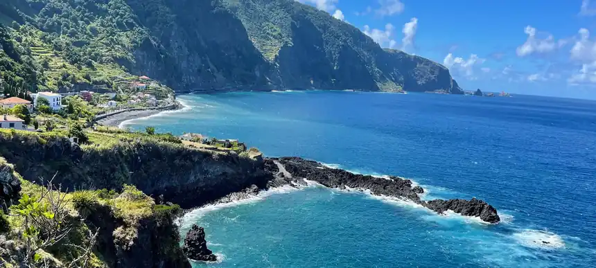 Cliffs, terraced slopes and Atlantic water on the north coast of Madeira