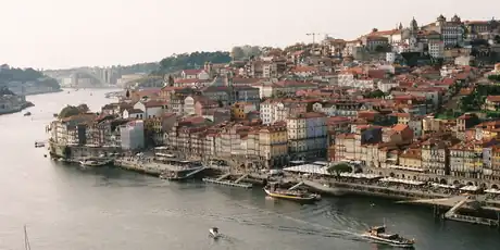 The Douro river curving past the Ribeira and Vila Nova de Gaia in Porto