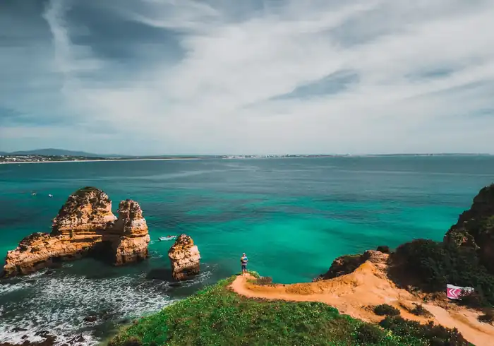 Golden cliffs, sea stacks and turquoise water near Lagos in the Algarve