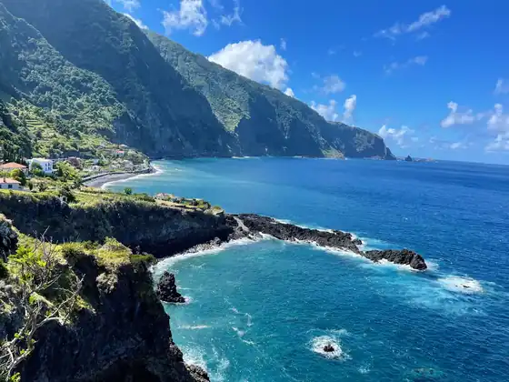 Atlantic cliffs falling into deep blue water