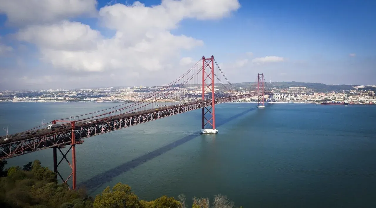 The 25 de Abril bridge over the Tagus, with Lisbon on the far bank
