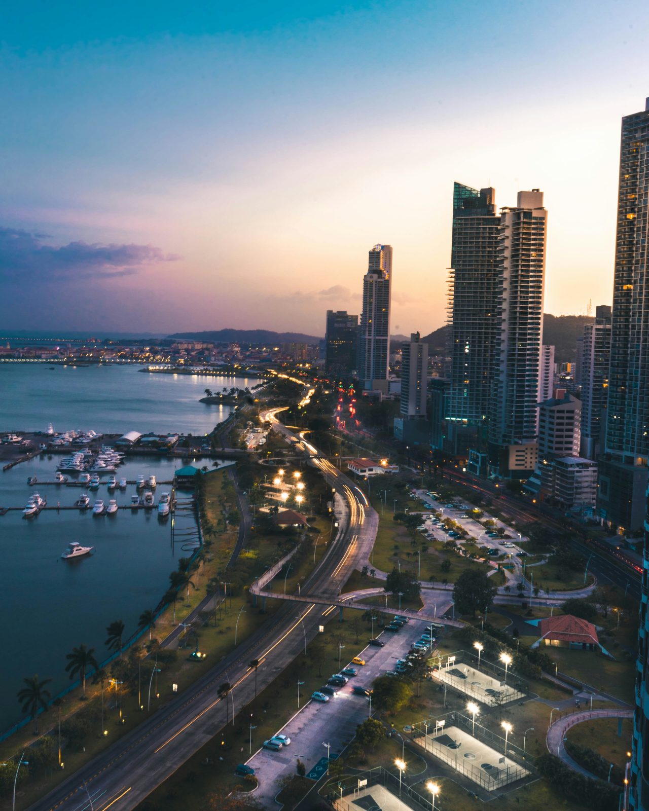 Panama City at dusk, the Cinta Costera and the marina below the banking district towers